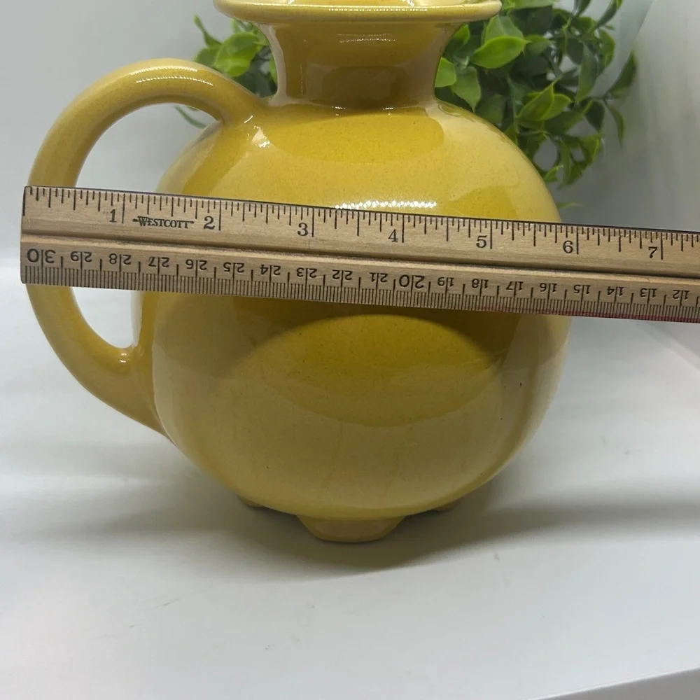 Frankoma Pottery Yellow MCM #82 Carafe dating back to the 1950s.